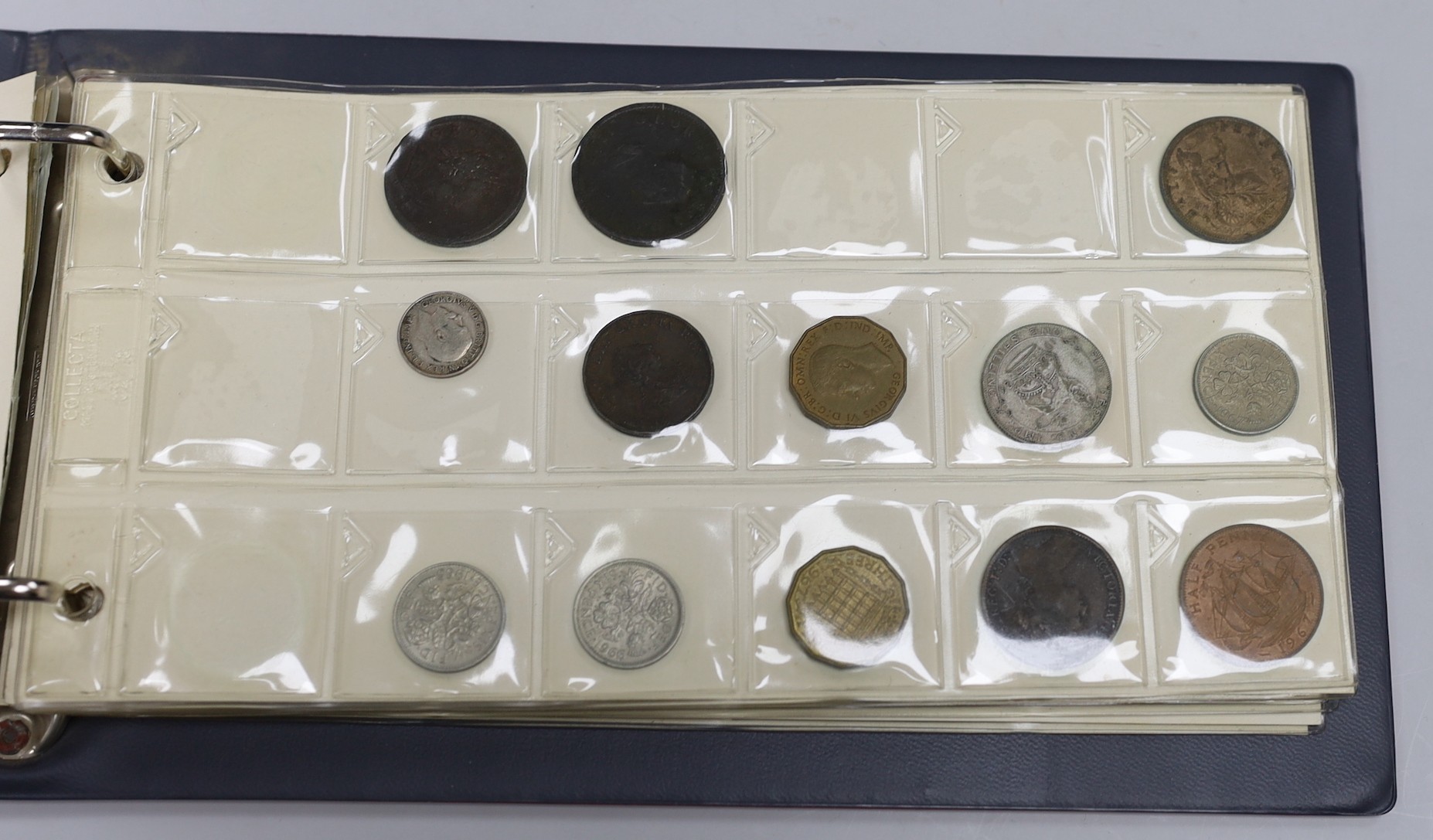 Two albums of UK coins, George III to George VI to include 1921 to 1946 halfcrowns, 1807 penny VF, 1805 Irish halfpenny AVF, a 'Revolution Jubilee 1788' medal etc